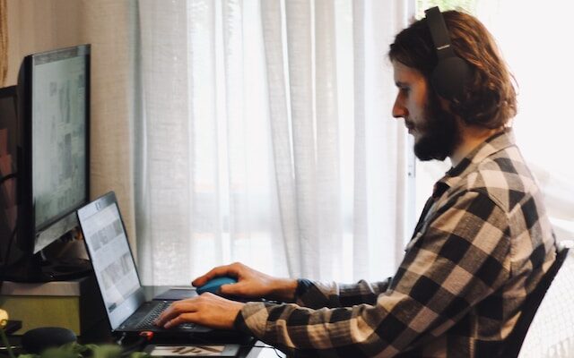 Man using Computer PC in a home office