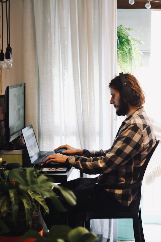 Man using Computer PC in a home office