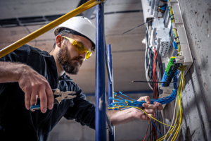 rewiring specialist electrician re wiring a homes electrical outlet