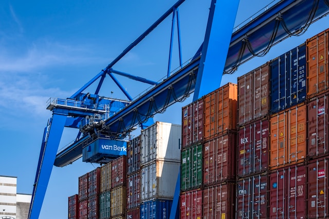 overhead crane working next to dock on shipping cranes