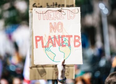 a cardboard sign saying there is no planet B